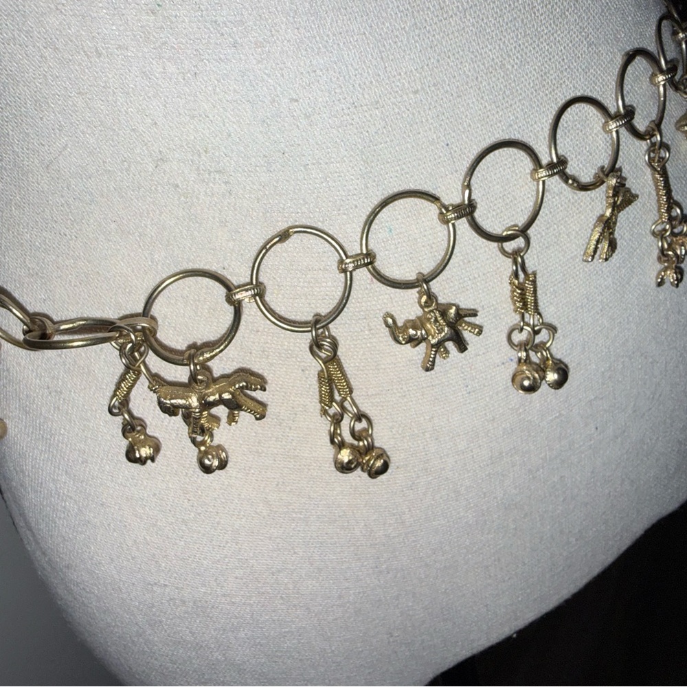 Unlisted Gold-Tone Charm Necklace with Animal and Bell Charms